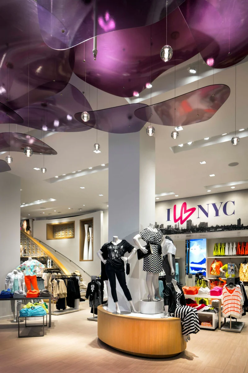 Mannequins standing on display tables surrounded by colorful clothing at the flagship retail store of Lane Bryant in Midtown Manhattan. MEP provided by 2L Engineering.