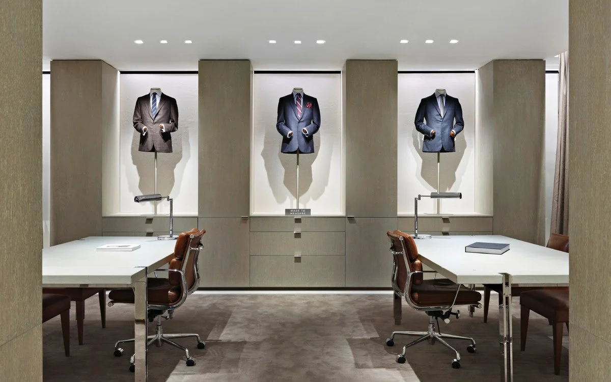 Suited up mannequins by private meeting tables in Barney's New York department store. MEP provided by 2L Engineering.