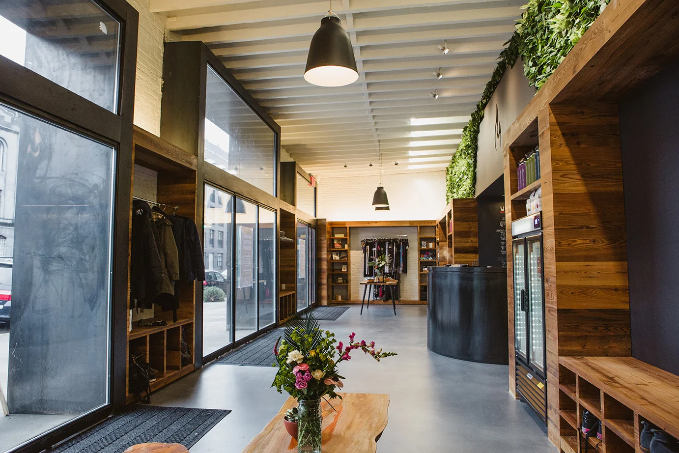Reception and retail area with storage spaces for guests in the Modo Yoga located in Brooklyn, New York. MEP designed by 2L Engineering.