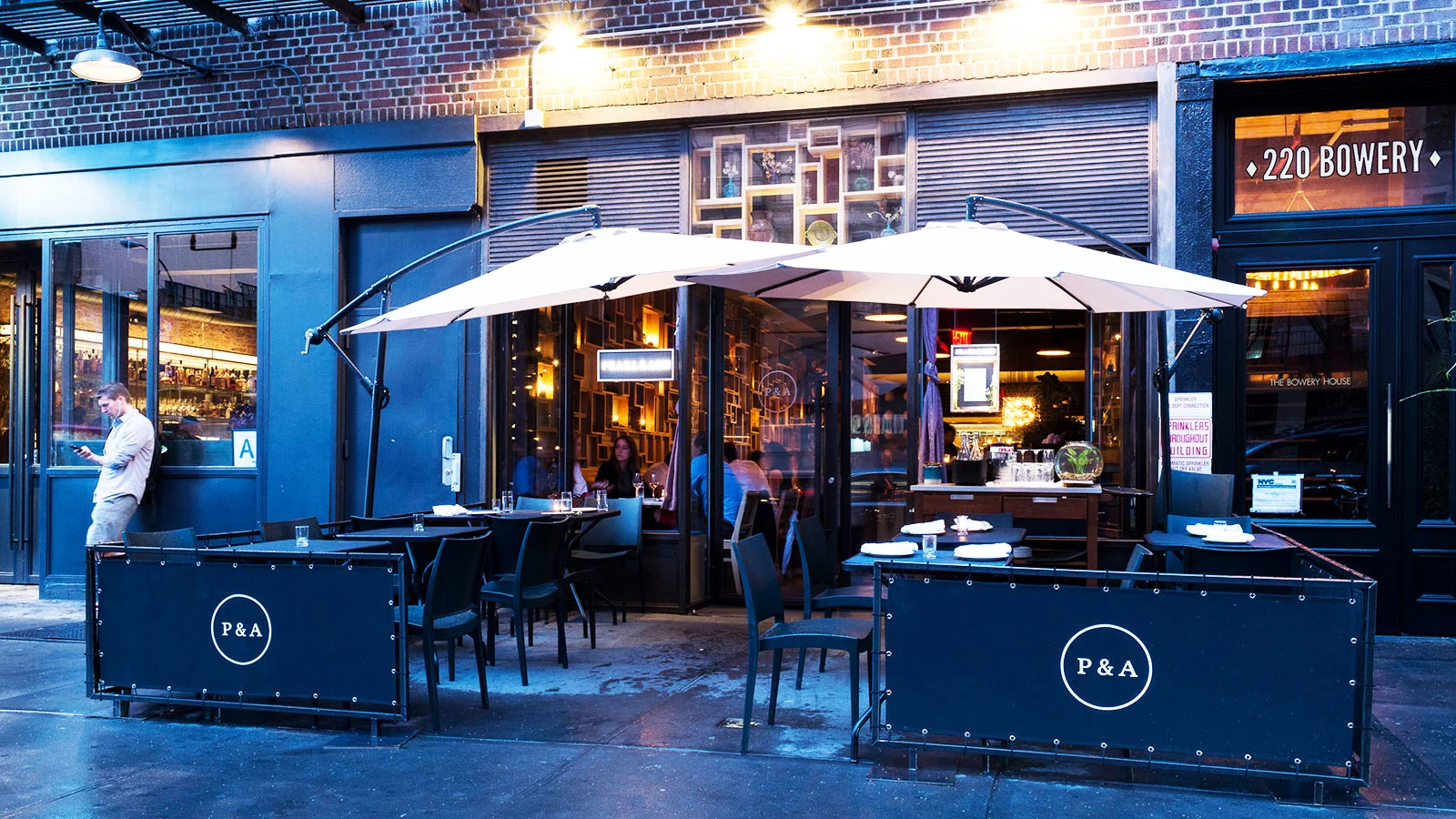 Outdoor seating at restaurant and wine bar, Pearl and Ash, on Bowery Street in New York. MEP designed by 2L Engineering.