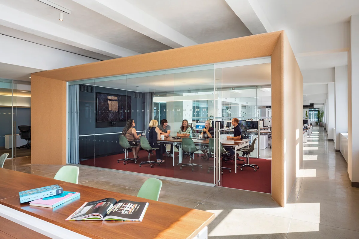 People strategizing and having a meeting in a private conference room located in the Droga5 offices. MEP designed by 2L Engineering.