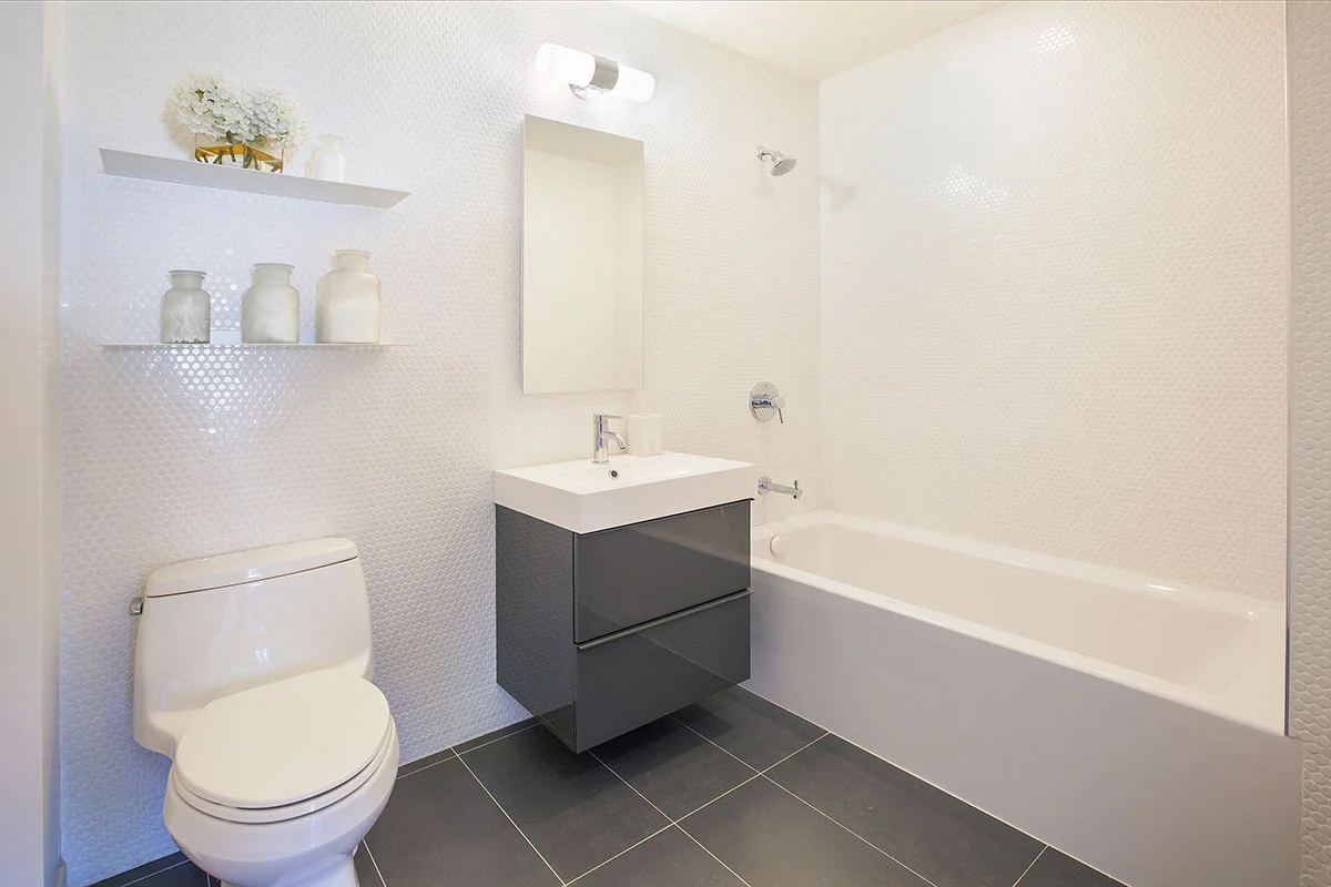 The bathroom of an apartment at The Lefferts House at 195 Hawthorne Street with MEP-FP engineering services provided by 2L Engineering