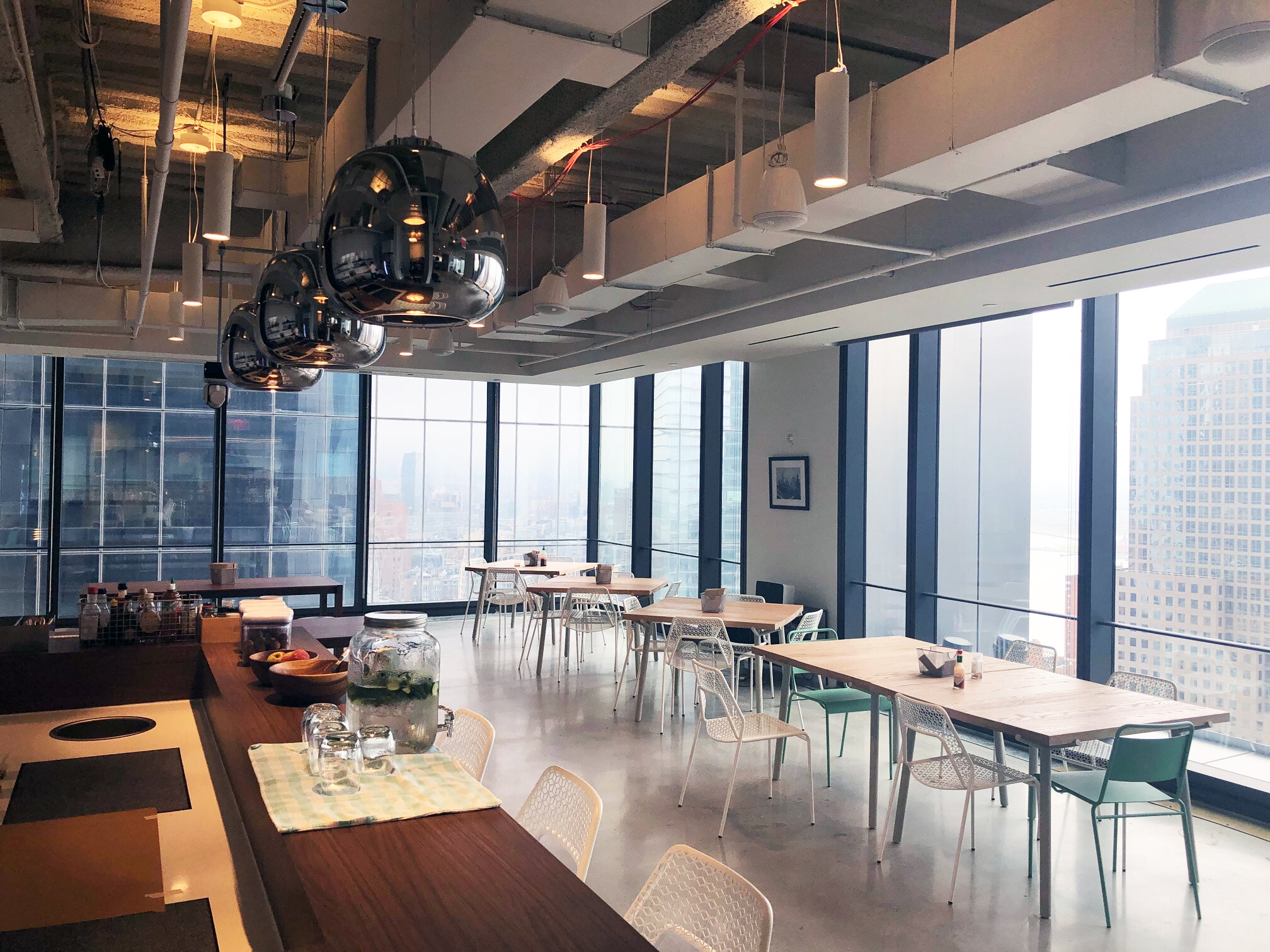 Interior pantry and cafe at the 3 WTC Asana office with MEP-FP engineering services provided by 2L Engineering.