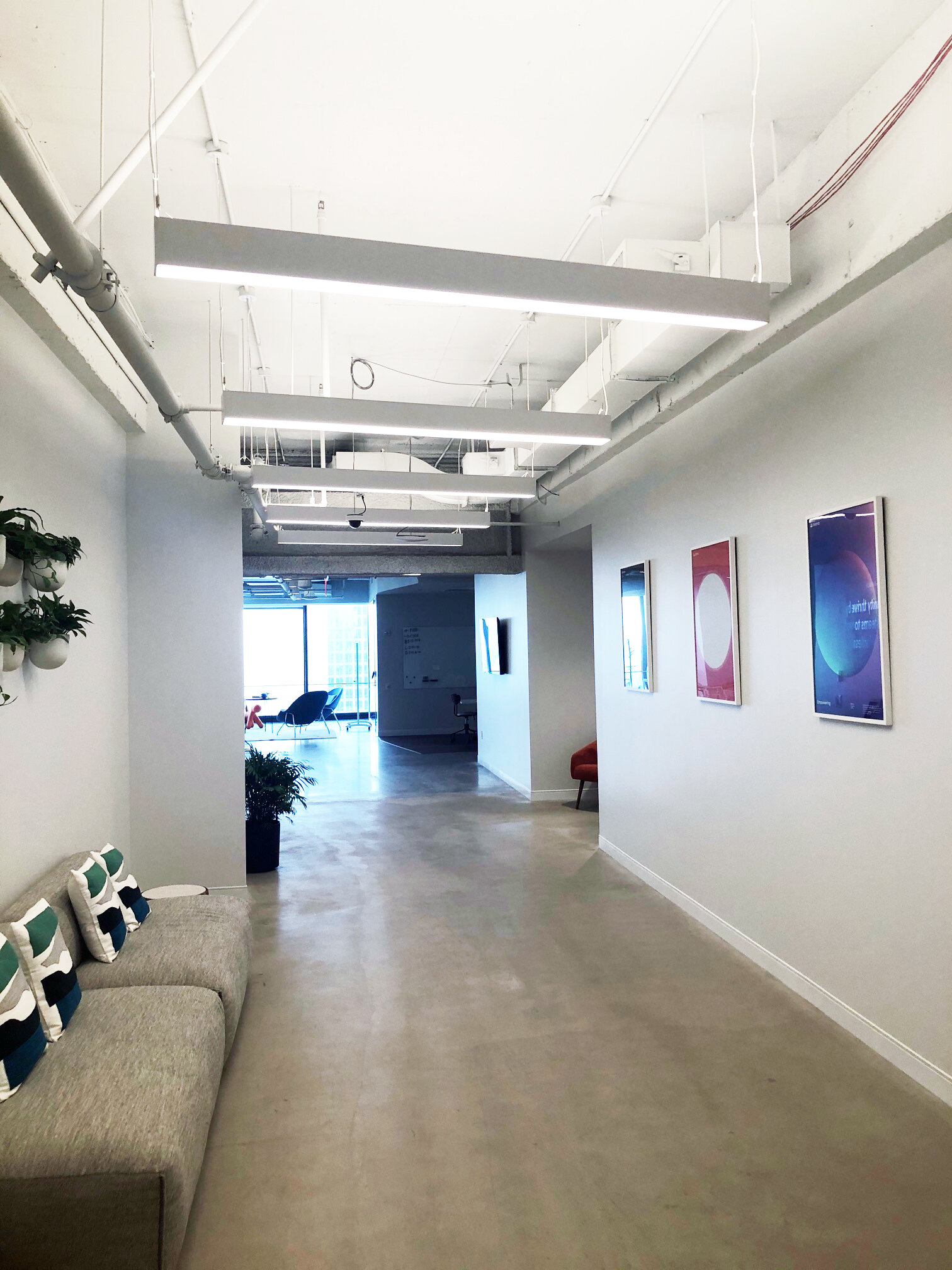 Hallway at the 3 WTC Asana office with MEP-FP engineering services provided by 2L Engineering.