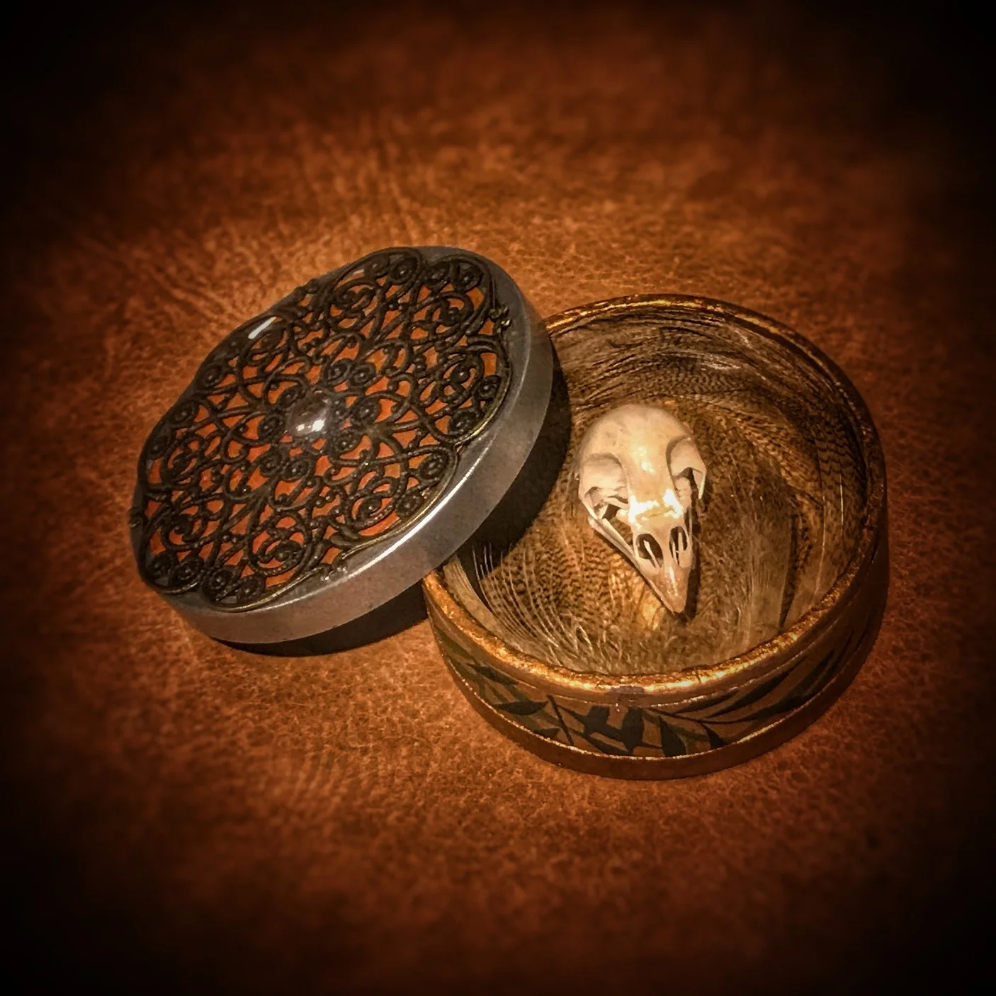 I created a series of “mobile reliquaries” for The Trophy Room exhibit at Stapleton Gallery. The new pieces were Inspired by a discussion held with the curators when they visited my studio earlier this year. We talked about the idea of hunting camps, earlier settlers and nomadic indigenous people. I mentioned my fascination with the sentimental and trophy objects people chose to carry (horseback, on wagons, by foot). Trophy’s would have to be mobile. A series of five new sculptures were created for the exhibit, four of which were contained within and included a simple Copenhagen can . The piece pictured here is titled, “Saffronia.”
