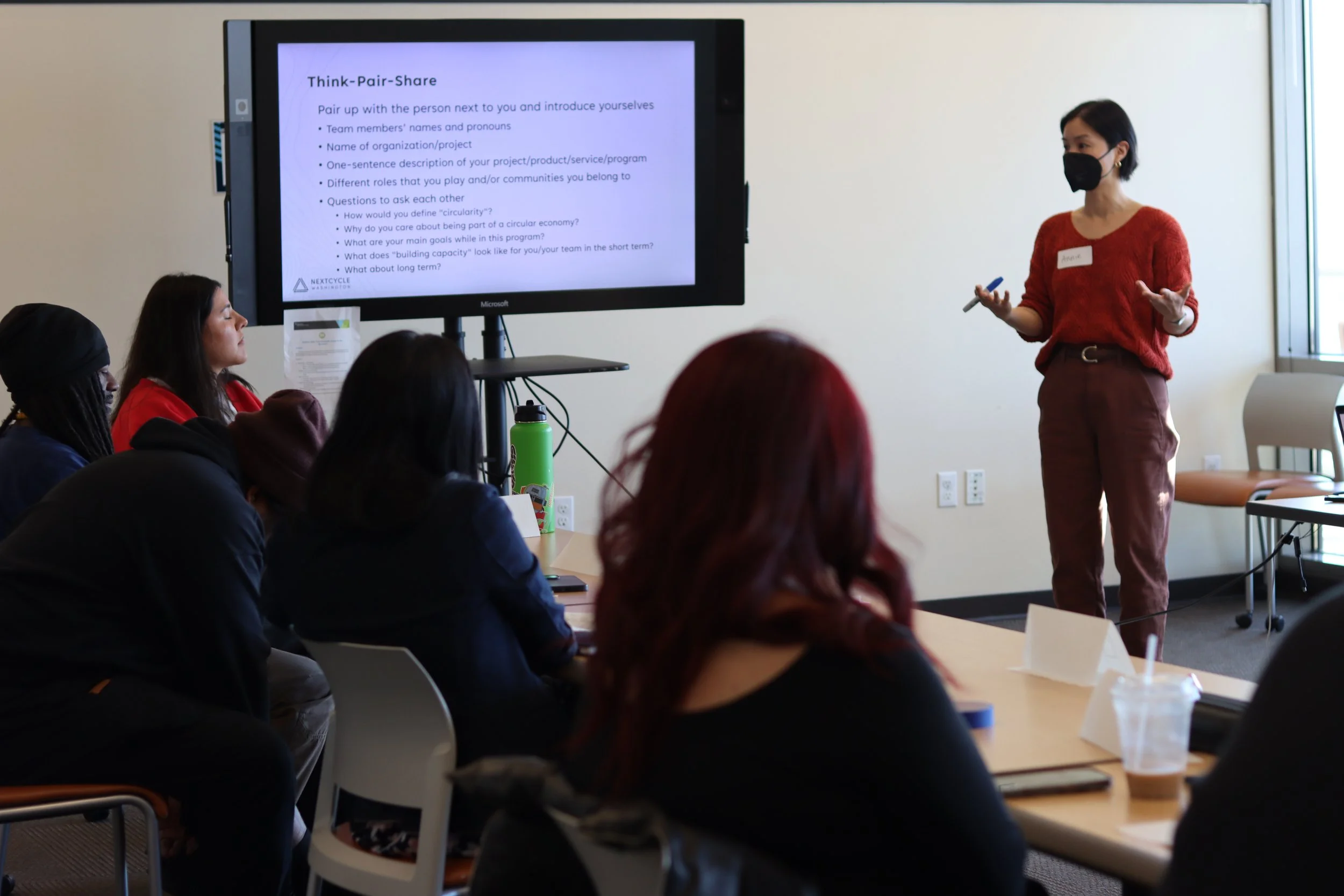 Annie Ly from NextCycle presenting a Think-Pair-Share exercise to the group