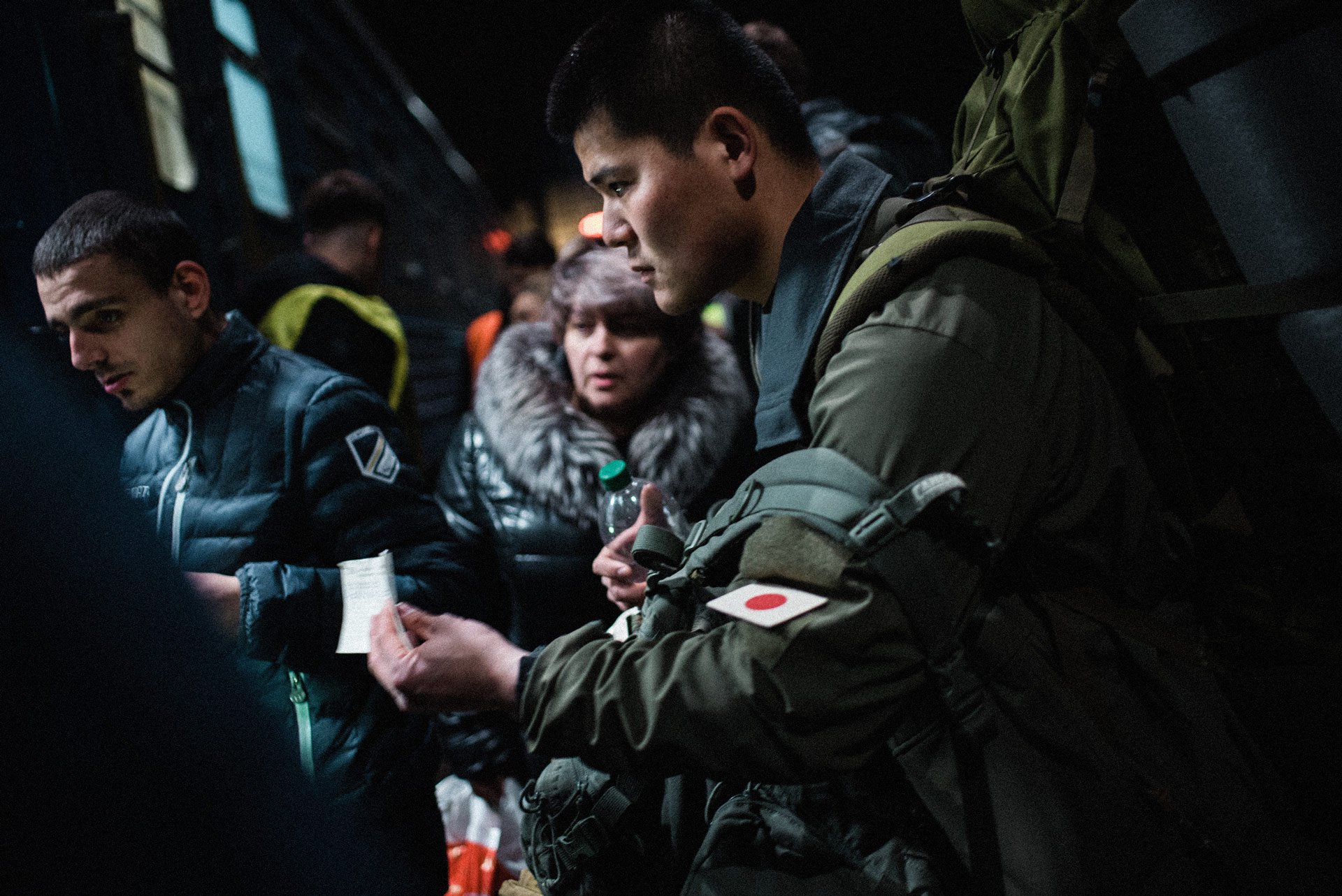 A japanese mercenary soldier shows his ticket to the train as he prepares to board the train taking him to the front. Throughout Ukraine’s war with Russia many foreign soldiers flocked to the country to join the fight. All of those I met said they d