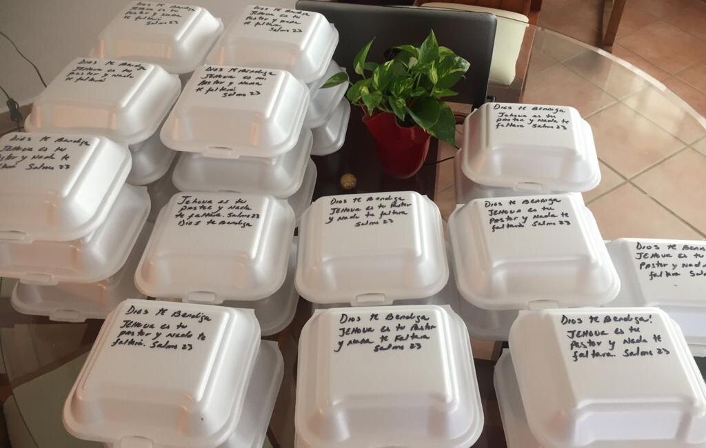 Meals prepared for the homeless with reminders of God’s love for them through Bible verses.