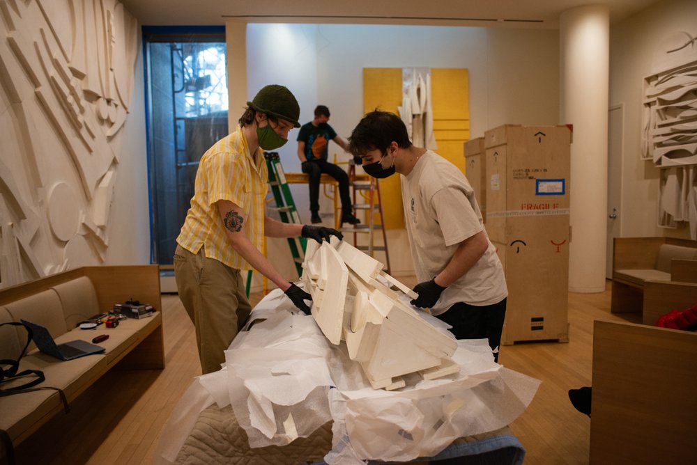  Art handlers preparing to move one of the  Trinity Columns . Photo by Andrew Seng. 