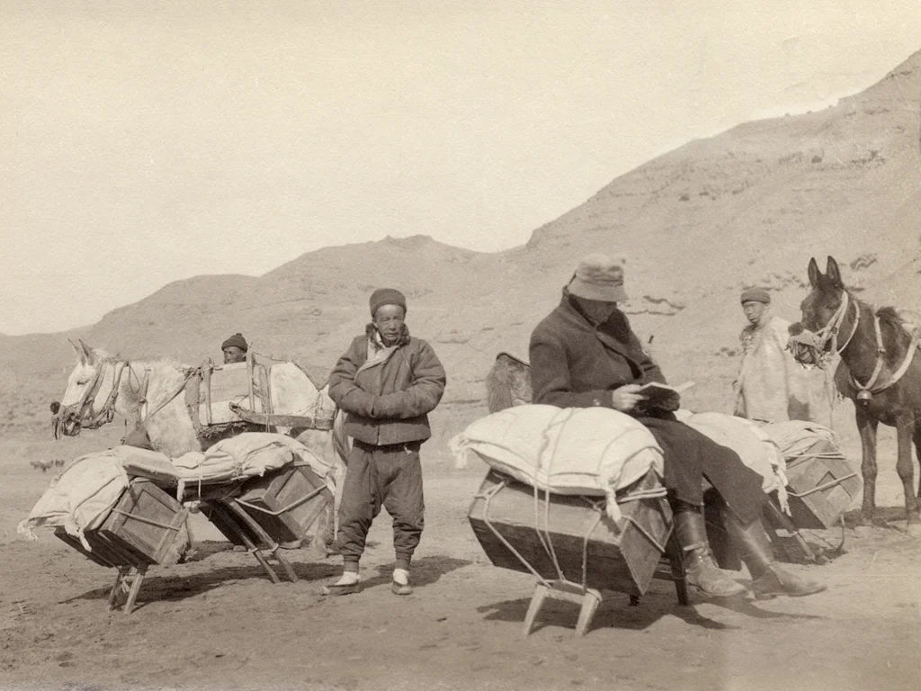 Rev. Watts O. Pye out on the missionary trail, open book on his lap, around 1925. He was the inspiration for Reverend Wesley Watson, who reads aloud from the Romantic Poets and Shakespeare to his Chinese sidekick, Ahcho, in River of Dust. 
