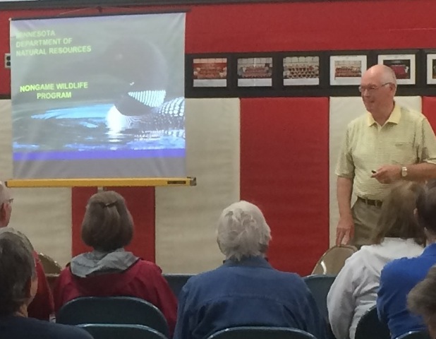 With over 35 years as a non-game wildlife champion, Carrol Henderson, Minnesota DNR, talked about loon migration patterns at the Aitkin Rivers and Lakes Fair, June 20.