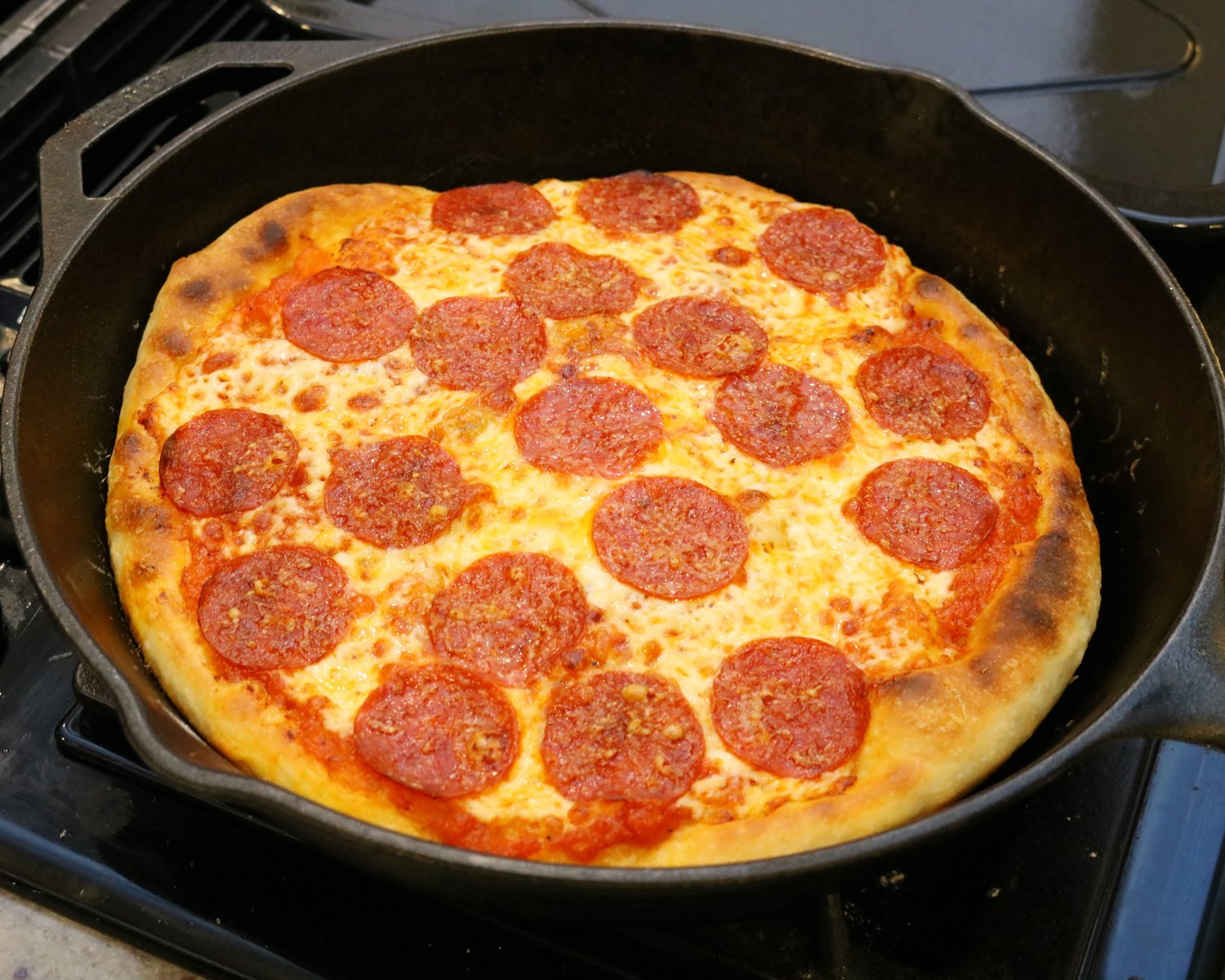 https://images.squarespace-cdn.com/content/v1/5ac8394baa49a16d3b6d71b3/1552002381061-U8038OZ4L9HOBTVFHEAY/Cast+Iron+Pizza+-+Pepperoni.JPG?format=1500w