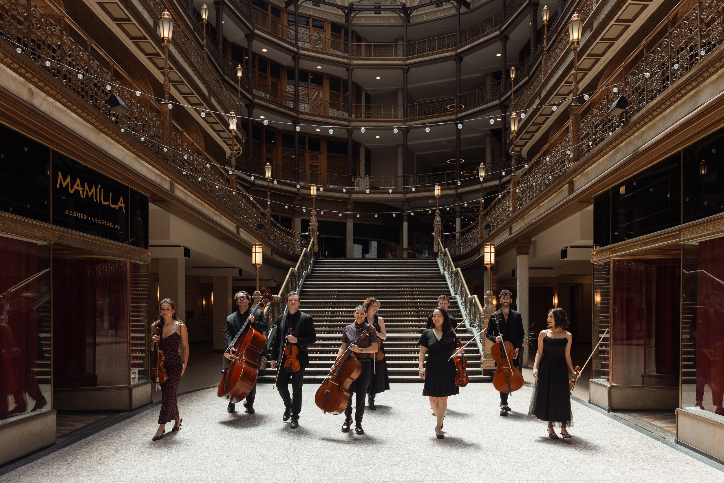 Opus 216 musicians standing together in the Cleveland Arcade