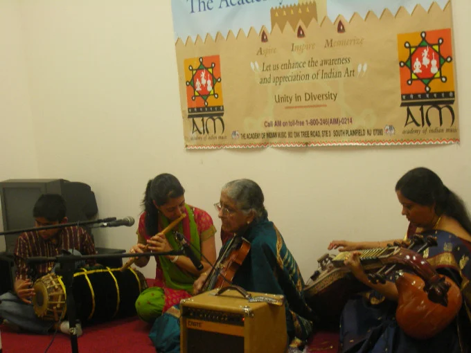 Rasika Shekar (flute), her brother (Mridangam), her grandmother (Violin), and her mother (Veena) performing live