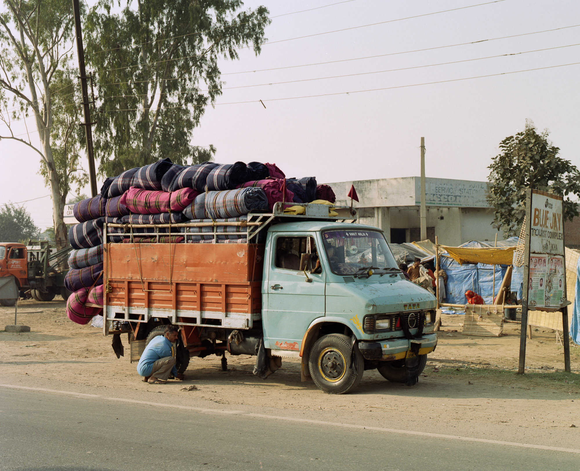 The less pure coloured, poorer quality shoddy blankets leave Panipat destined for the aid industries and the army.