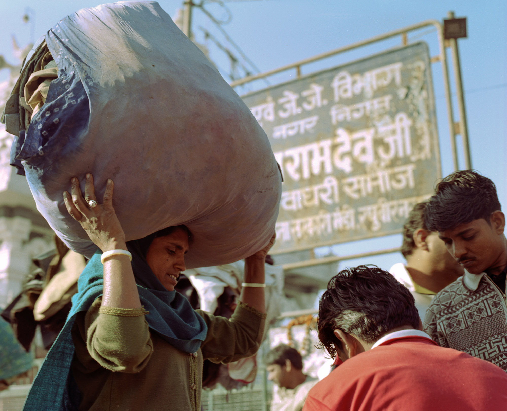 By late morning business slows down and piles of clothing lie waiting to be collected by their new owners.