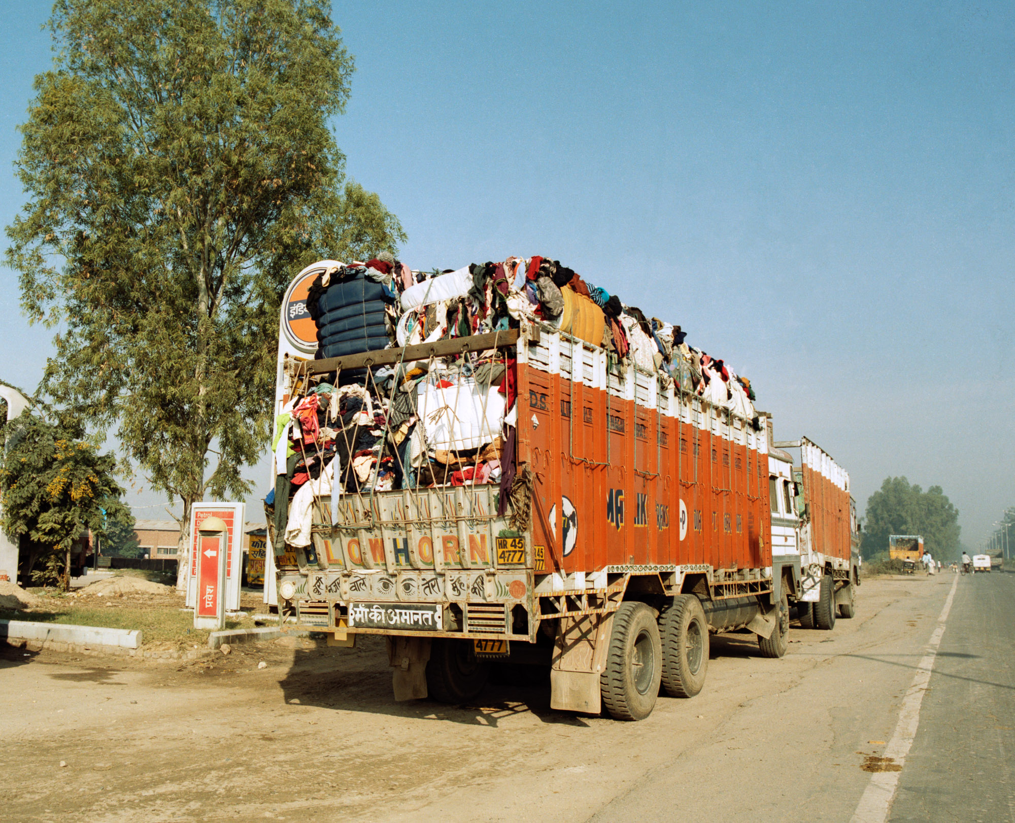  Over 100,000 tonnes of used clothing  is imported into India every year for recycling. Every day, truck loads of imported clothing bales are driven from India's ports up the Grand Trunk Road to Panipat, north of Delhi. 