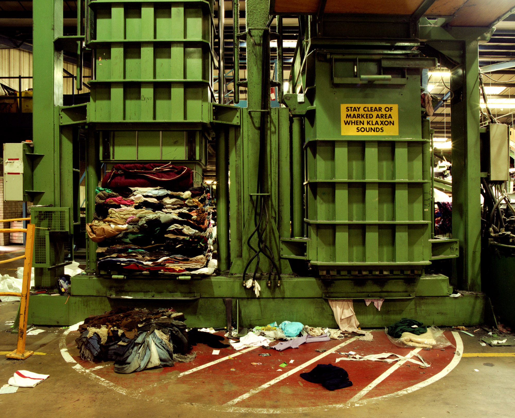 The sorted clothing is then compressed into bales weighing up to 2 tons, ready for transportation around the globe.