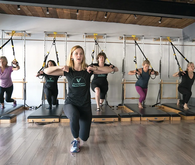 Above: Cheryl Turnquist leads a group class. Photo credit; Providence Monthly