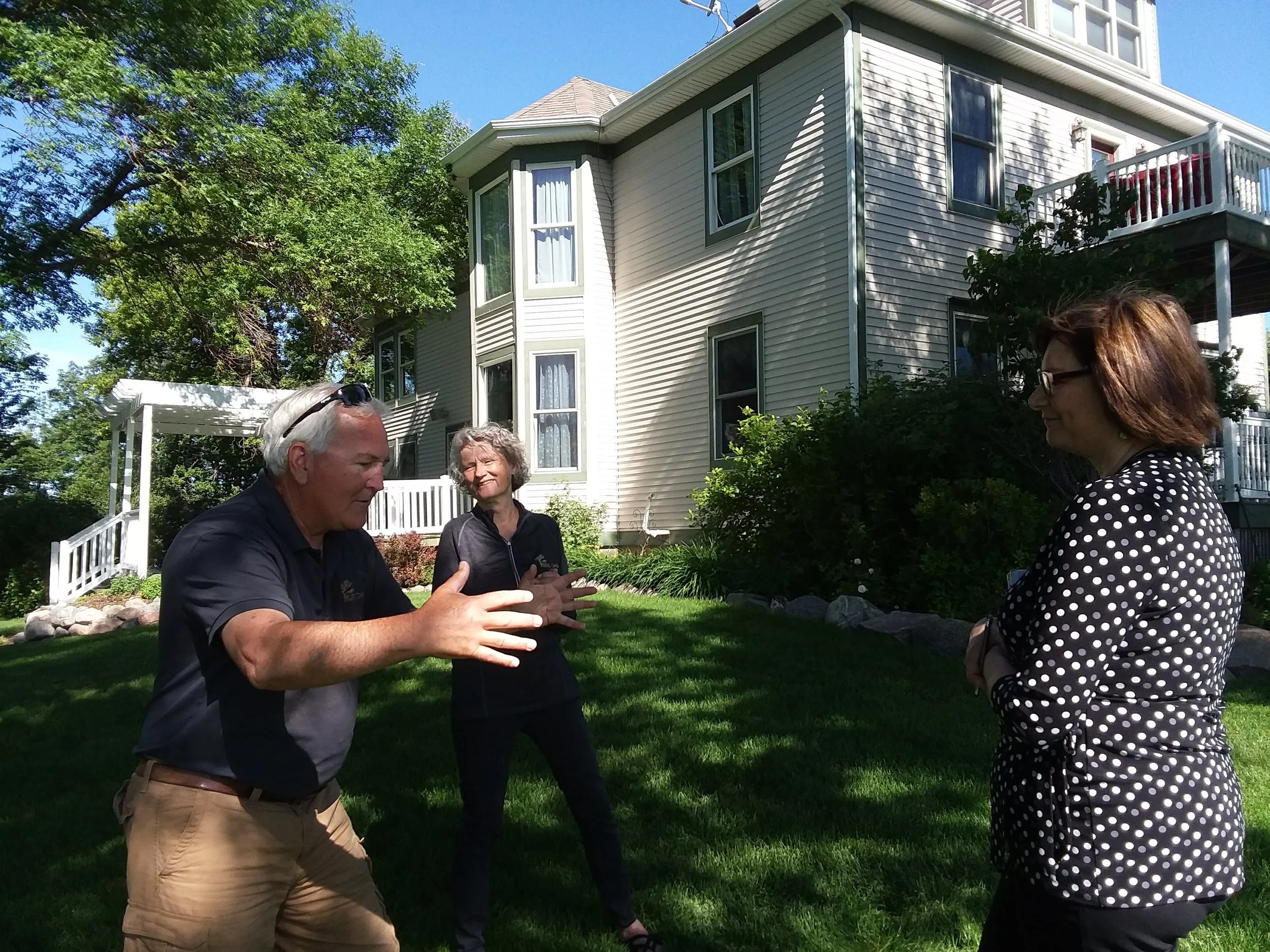 Dave Larson tells the story of Rustic Oaks to Sheri Holm of West Central Initiative while Anne Larson looks on.