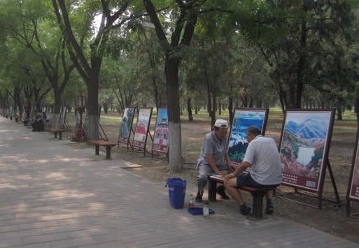 Men playing a game along one of the walkways through the arbor.
