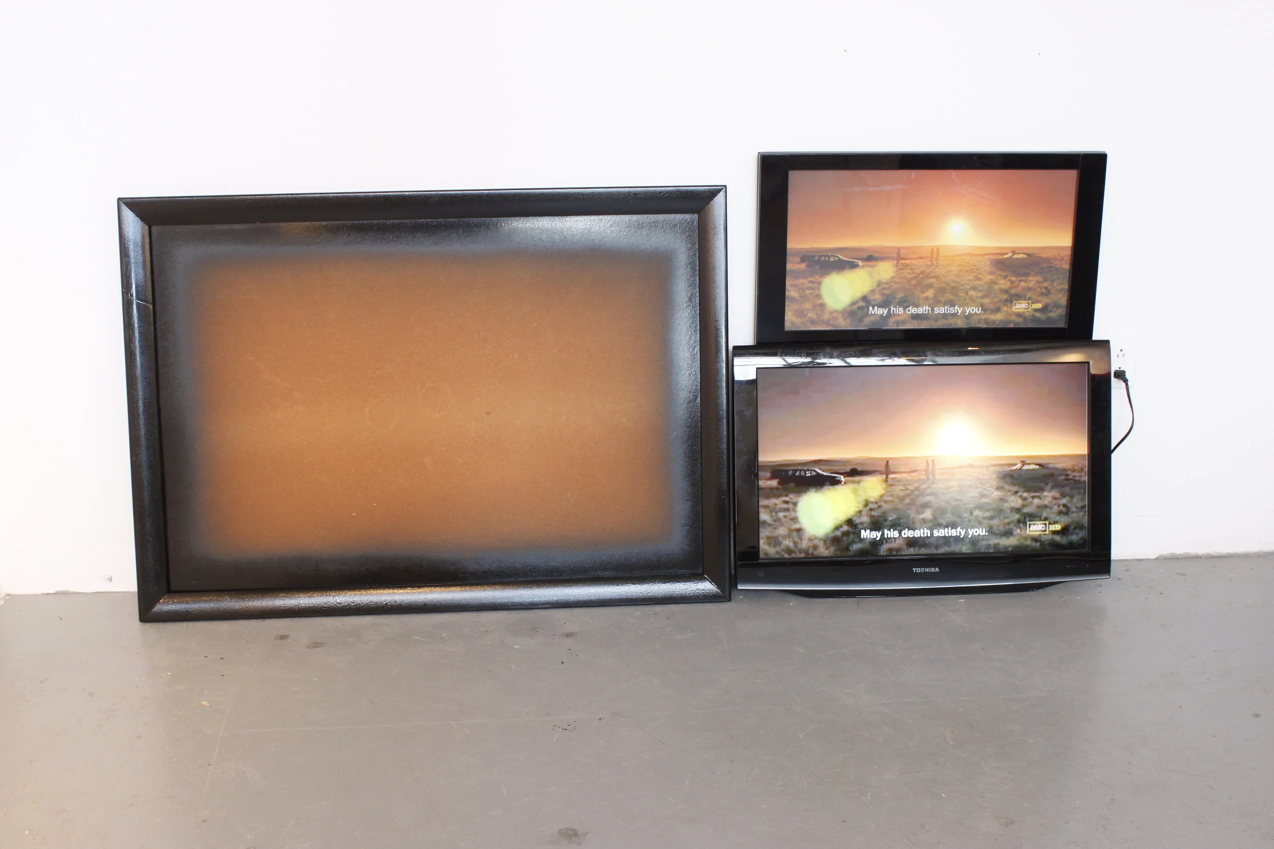   may his death satisfy you,&nbsp; 2012  wood frame,&nbsp;spray paint, false television, digital print, flatscreen, digital video  dimensions variable 