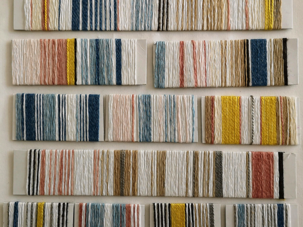 Over the years my practice has developed using natural dyes and weave. I have often taken inspiration from the pattern books for my work this was a yarn wrapping collage made using paper yarns dyed with natural dyes