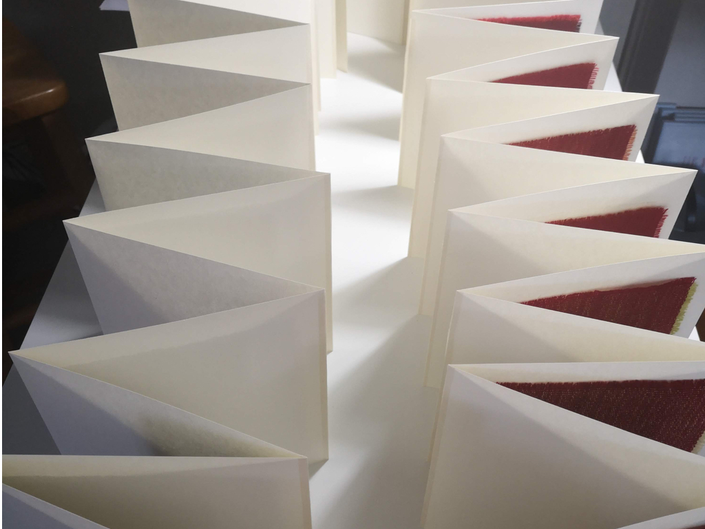 i designed a simple concertina sample book that would allow the samples to be mounted and stand alone.