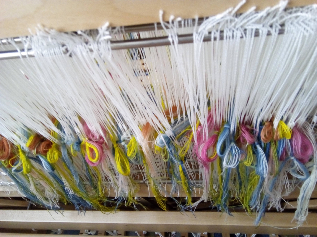 I decided to weave a ‘clouded’ callimanco with a repeat stripe 18 inches wide with a sett of 48 warps ends per inch. This made a total of 956 warp threads which took quite a while to thread up!
