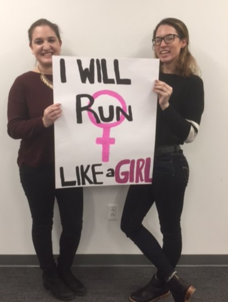 Jazmin Kay, right, and Aly Belknap, left. Sign by Aly Belknap, sophomore.