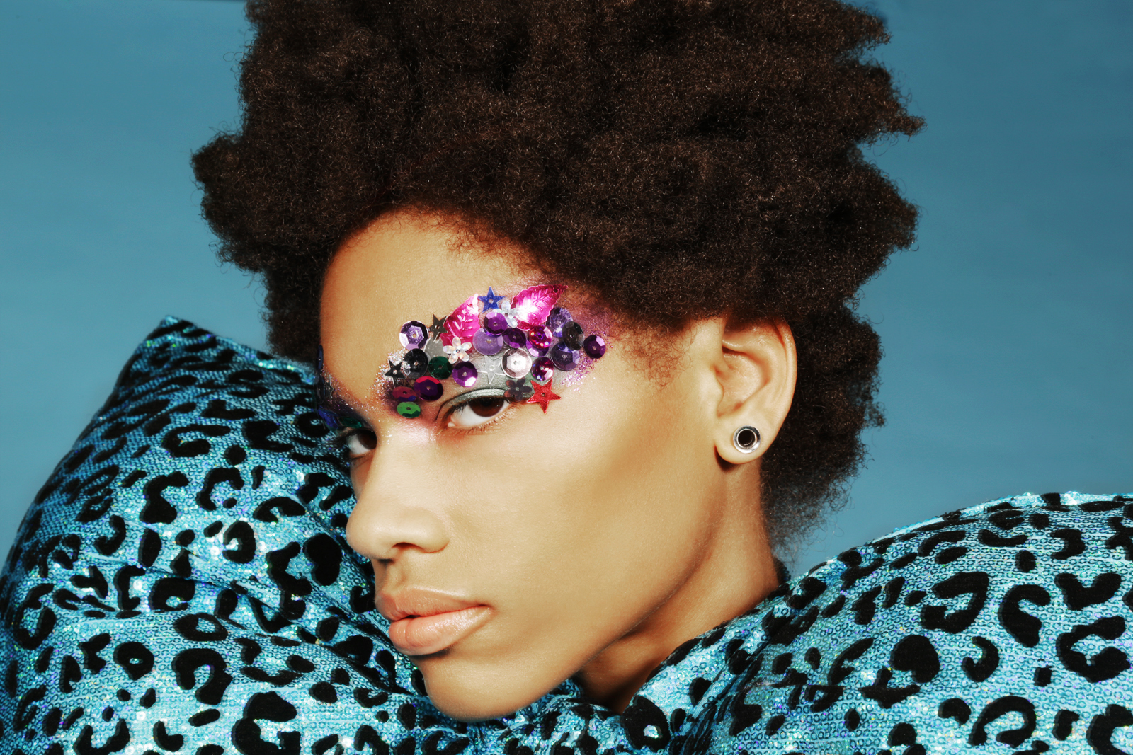Turquoise animal print bodysuit, pant and oversized bow by CHENG