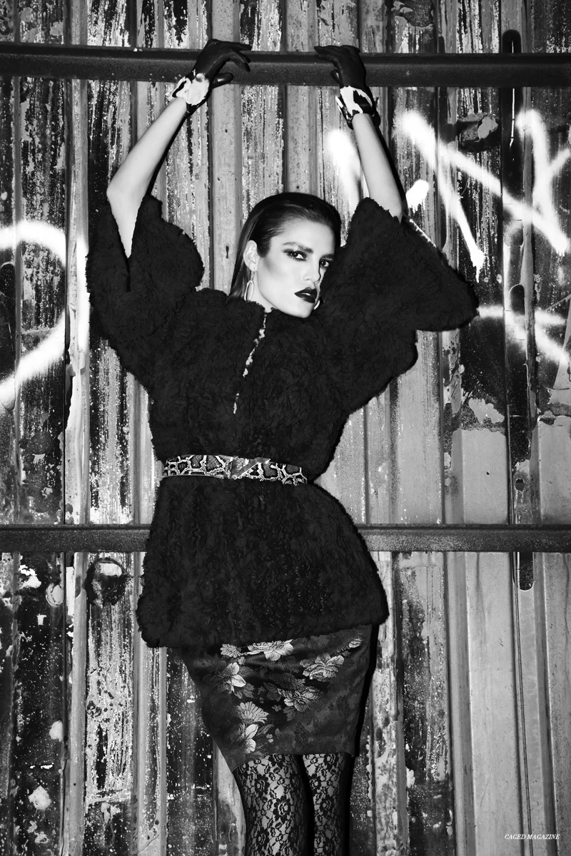 Black Ruffled Plush Jacket by Byron Lars Beauty Mark, Casablanca Shoes by Ritch Erani NYFC, Gloves by Wing & Weft Gloves, Earrings by Simon Alcantara, Belt by Apolinar, Gold Bra Top by Alexa Chapman, Leon Floral Skirt by Anne Fontaine