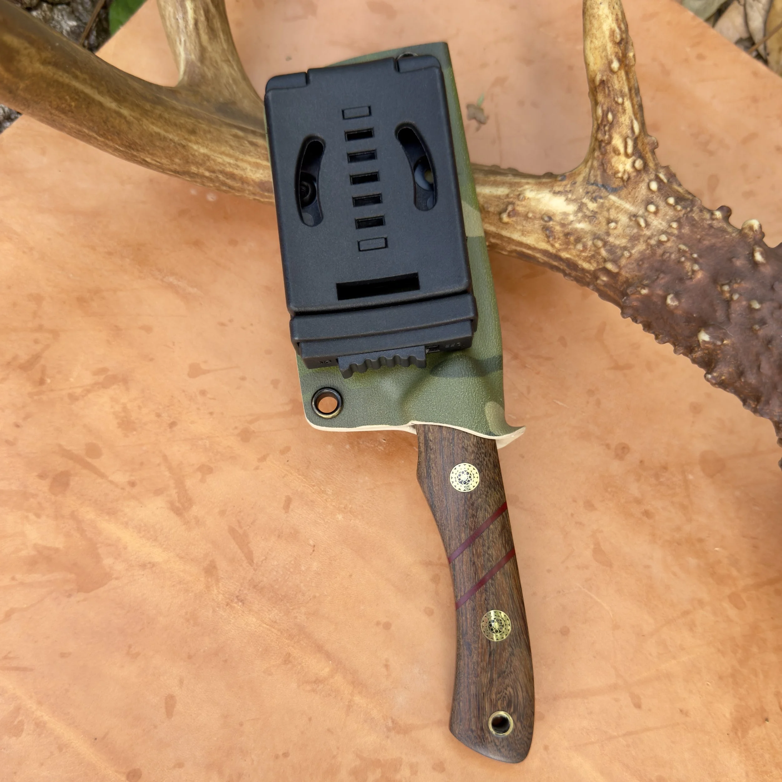 Back of Kydex sheath with adjustable belt clip for horizontal or vertical carry