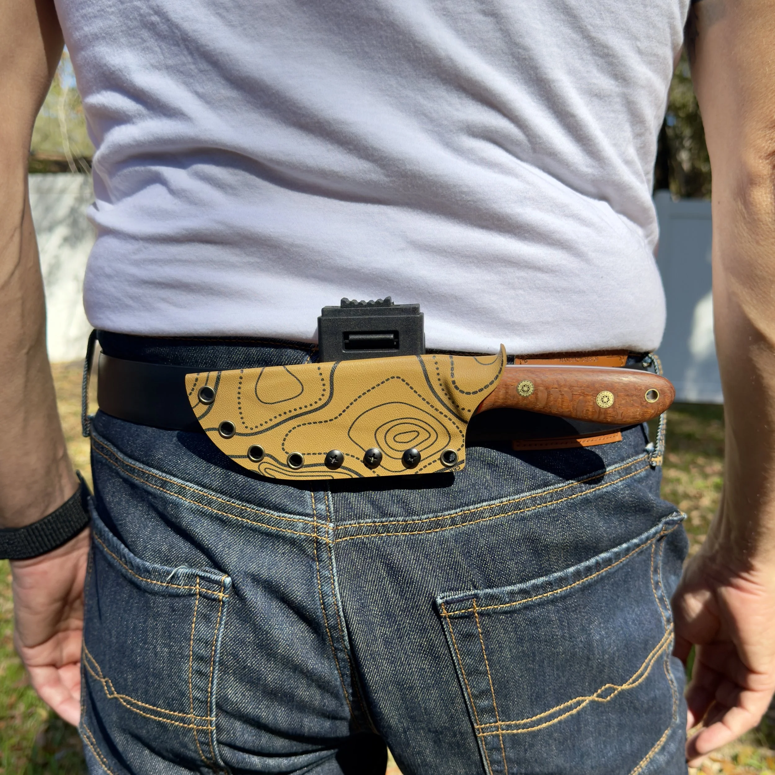 Custom hunting knife carried horizontally on belt in topo Kydex sheath