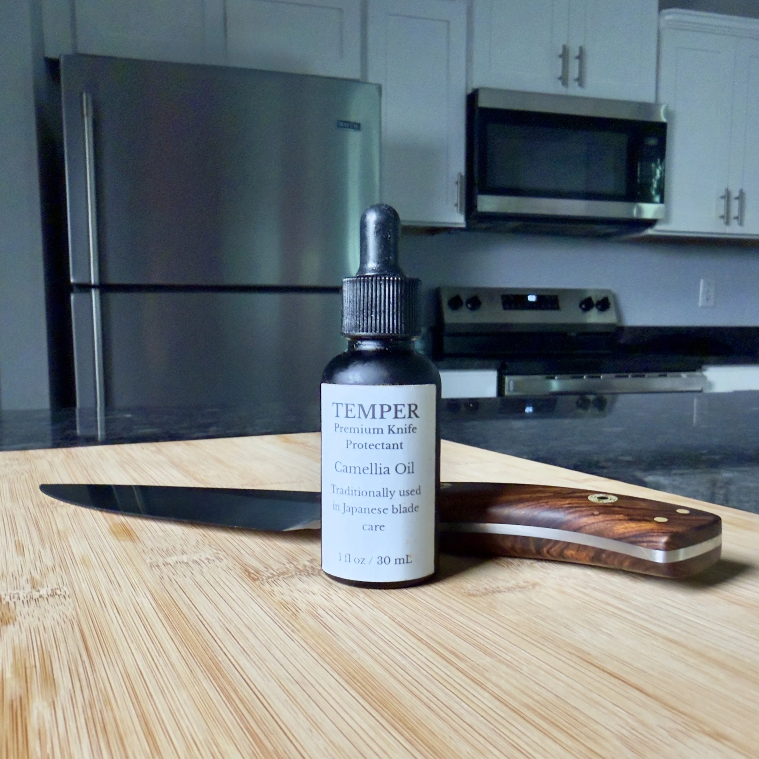 D. Carey handmade high carbon steel chef knife with the included 1 oz bottle of premium camellia oil for blade protection.