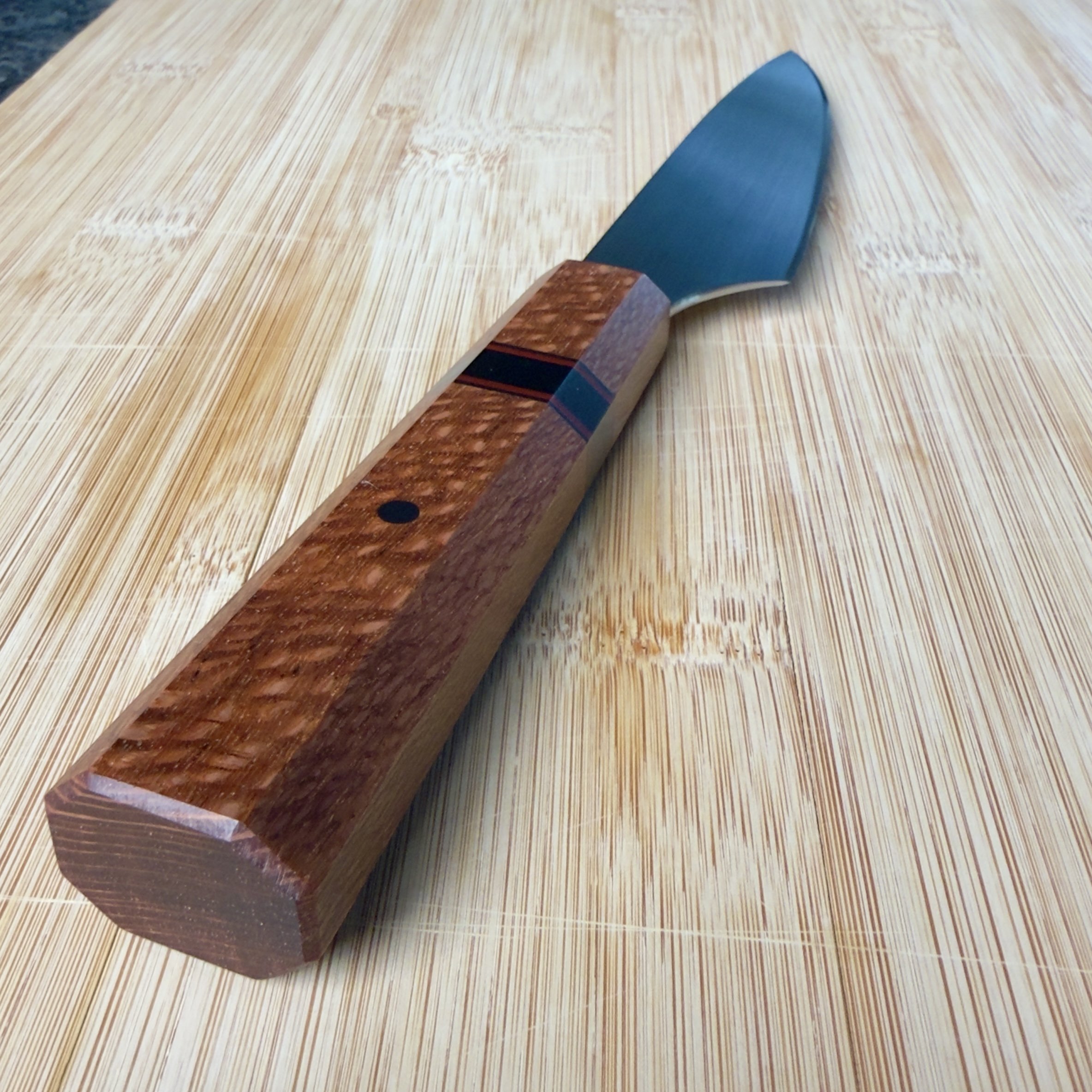Lacewood handle and spacer detail on custom handmade petty kitchen knife