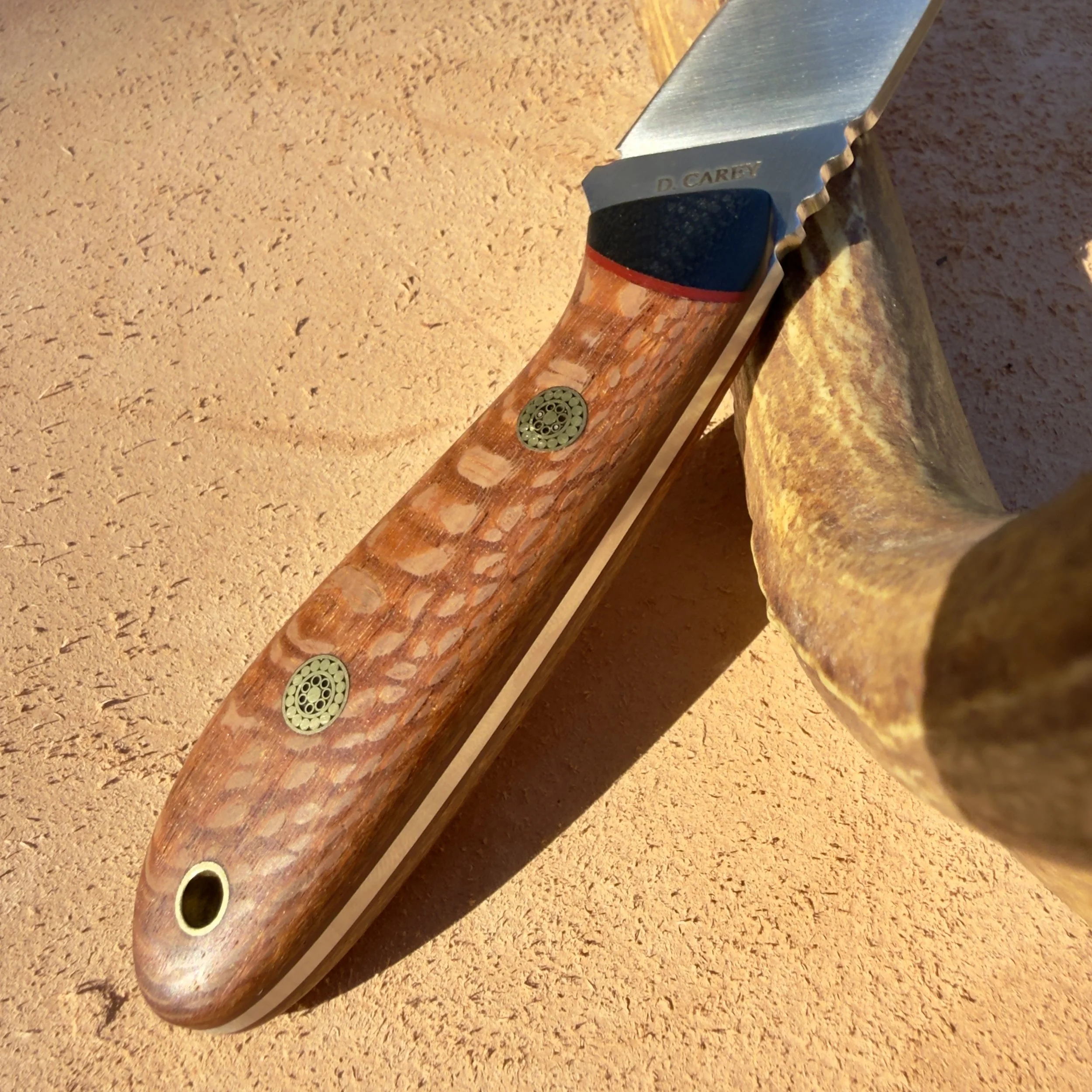 Lacewood knife handle with brass mosaic pins and red G-10 liners