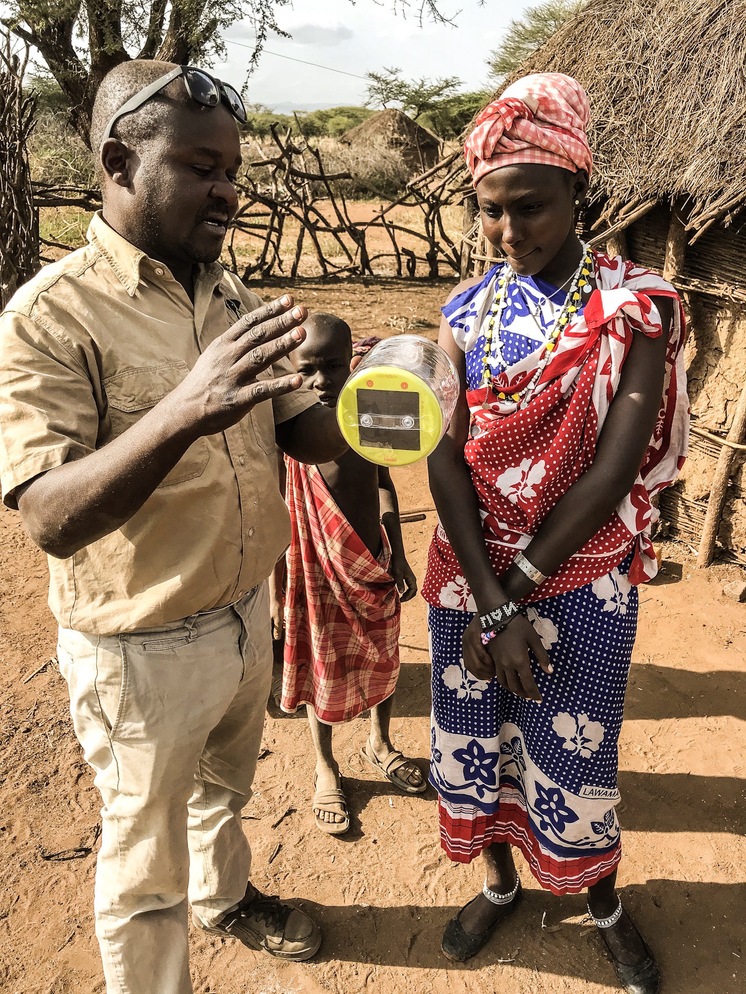 Distributing solar lights to Maasai family (Copy)