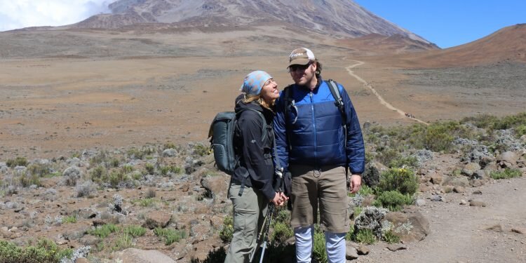 Honeymoon couple climbing Kilimanjaro