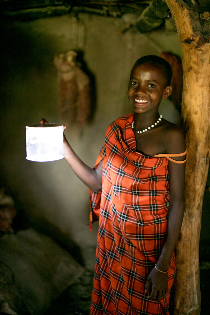 Maasai girl with solar light