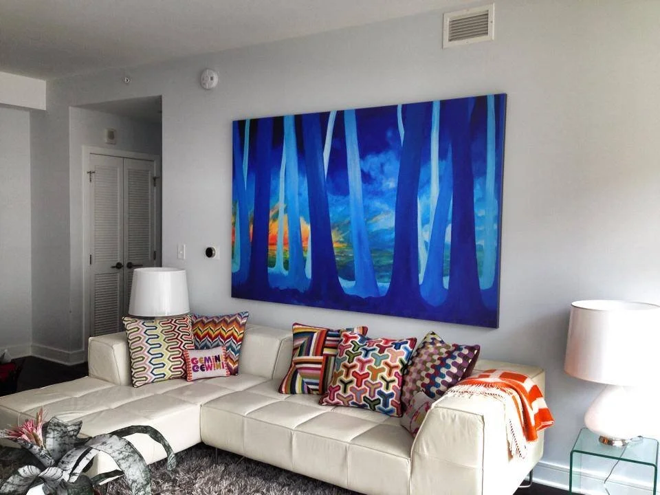 Large original painting by Aymar De Villele hanging above couch in a Weehawken NJ living room. Courtesy of Barsky Gallery in Hoboken NJ.