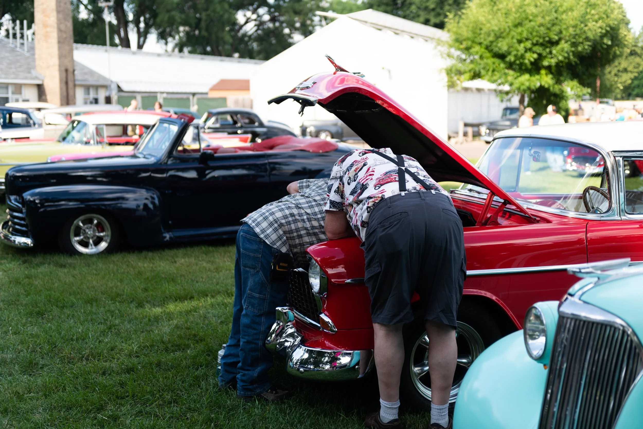 Checking out the engine, with suspenders. Back to the 50s Street Rod Show, Minnesota State Fairgrounds, June 2018.
