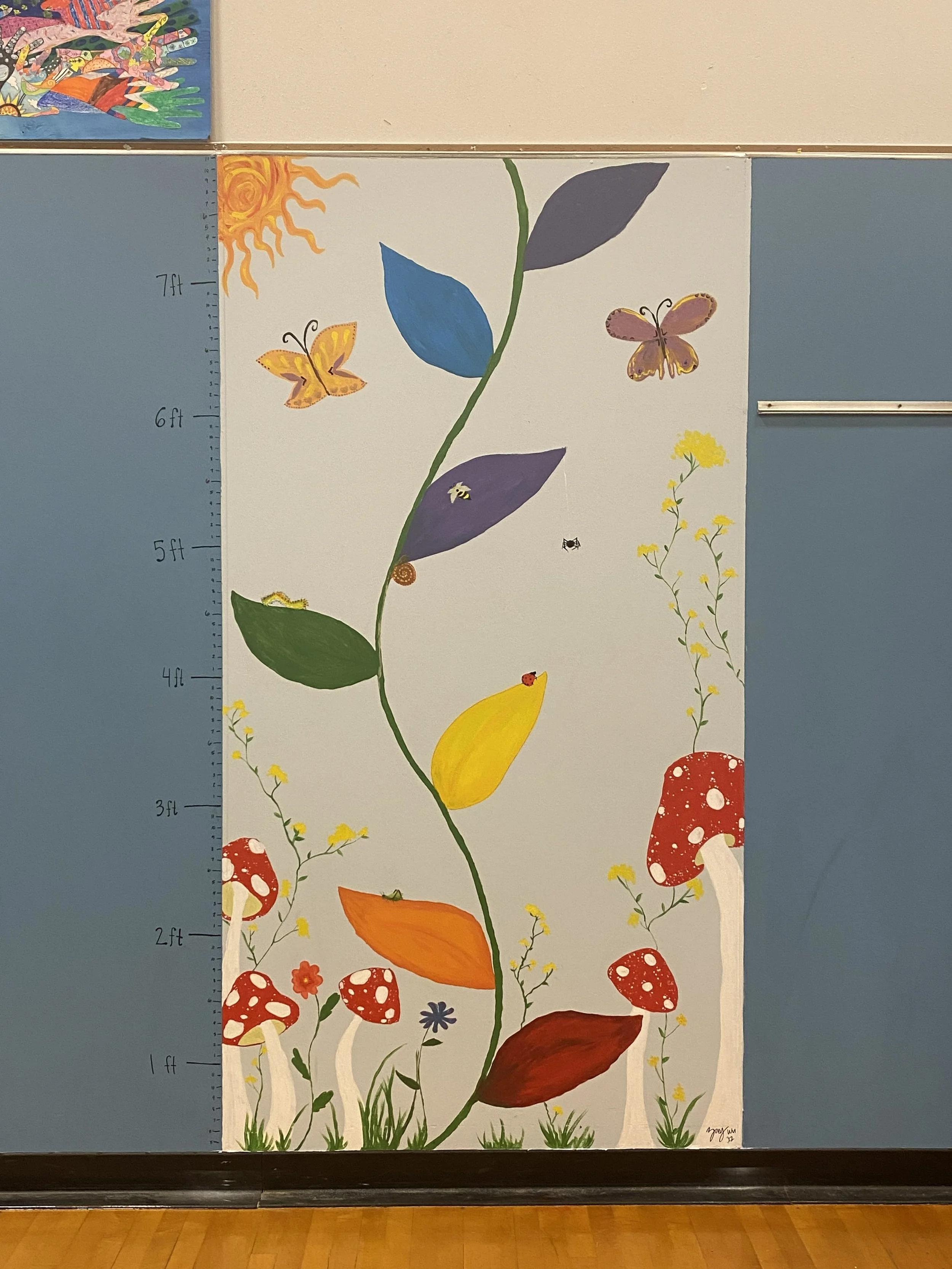  Student design turned into a mural for Sunrise Elementary. We worked with P.E. teacher to come up with designs.  I helped with the process of turning those designs into murals on the walls of the gym. 