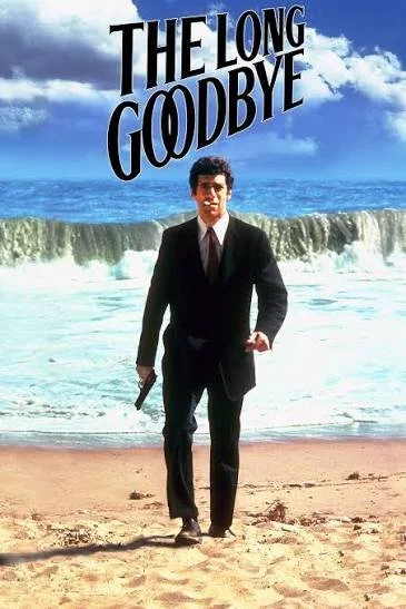 The Long Goodbye, Robert Altman (1973). film poster. man on beach wearing a suit smoking a cigarette and hold a gun.