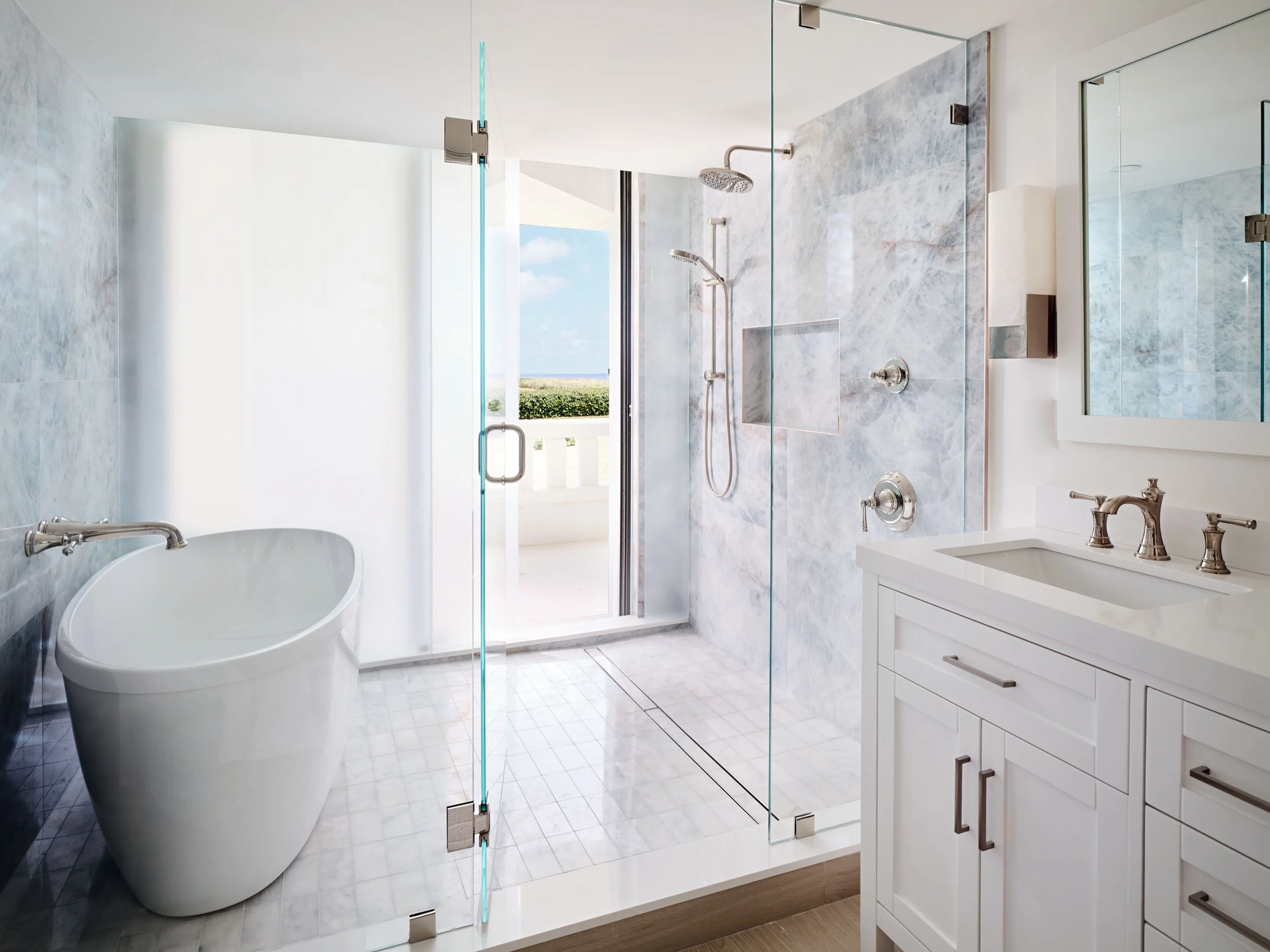 palm-beach-condo-renovation-whitney-ross-bathroom-tub-white-ocean.jpg
