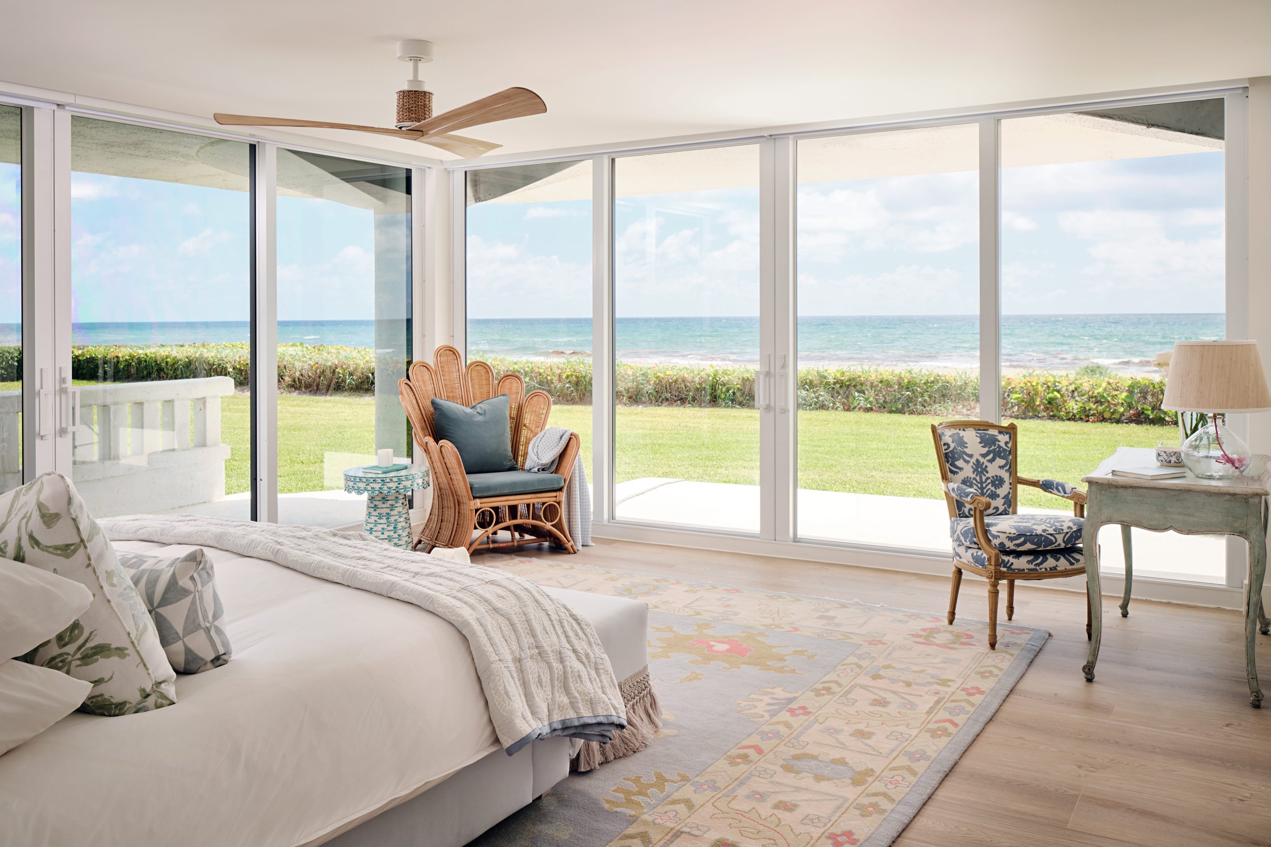 palm-beach-condo-renovation-whitney-ross-bedroom-coastal-ocean-rattan-chair-desk.jpg