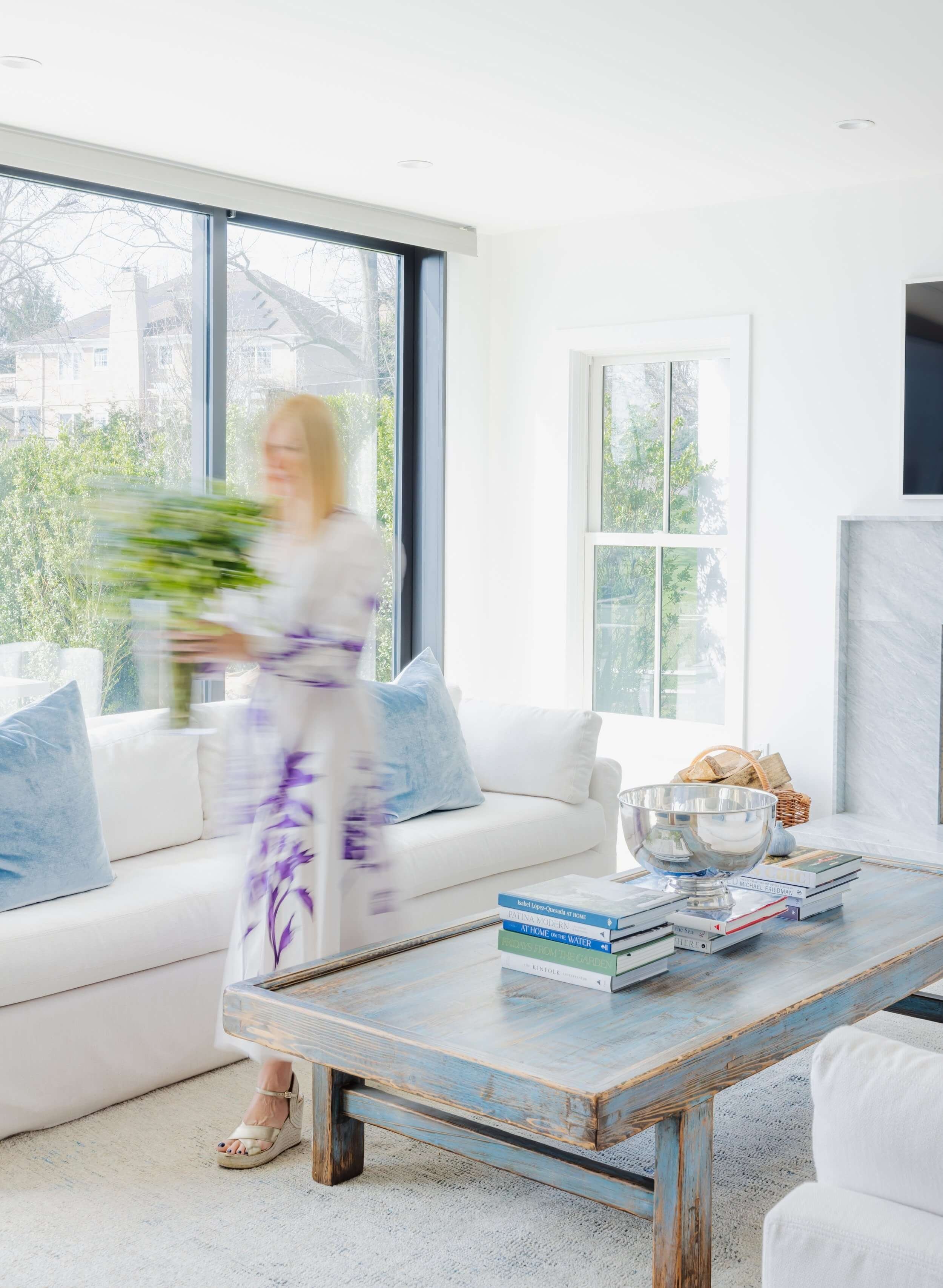 Whitney Ross of Whit & Well, styling a calm, coastal living room, as an Interior Designer in Connecticut