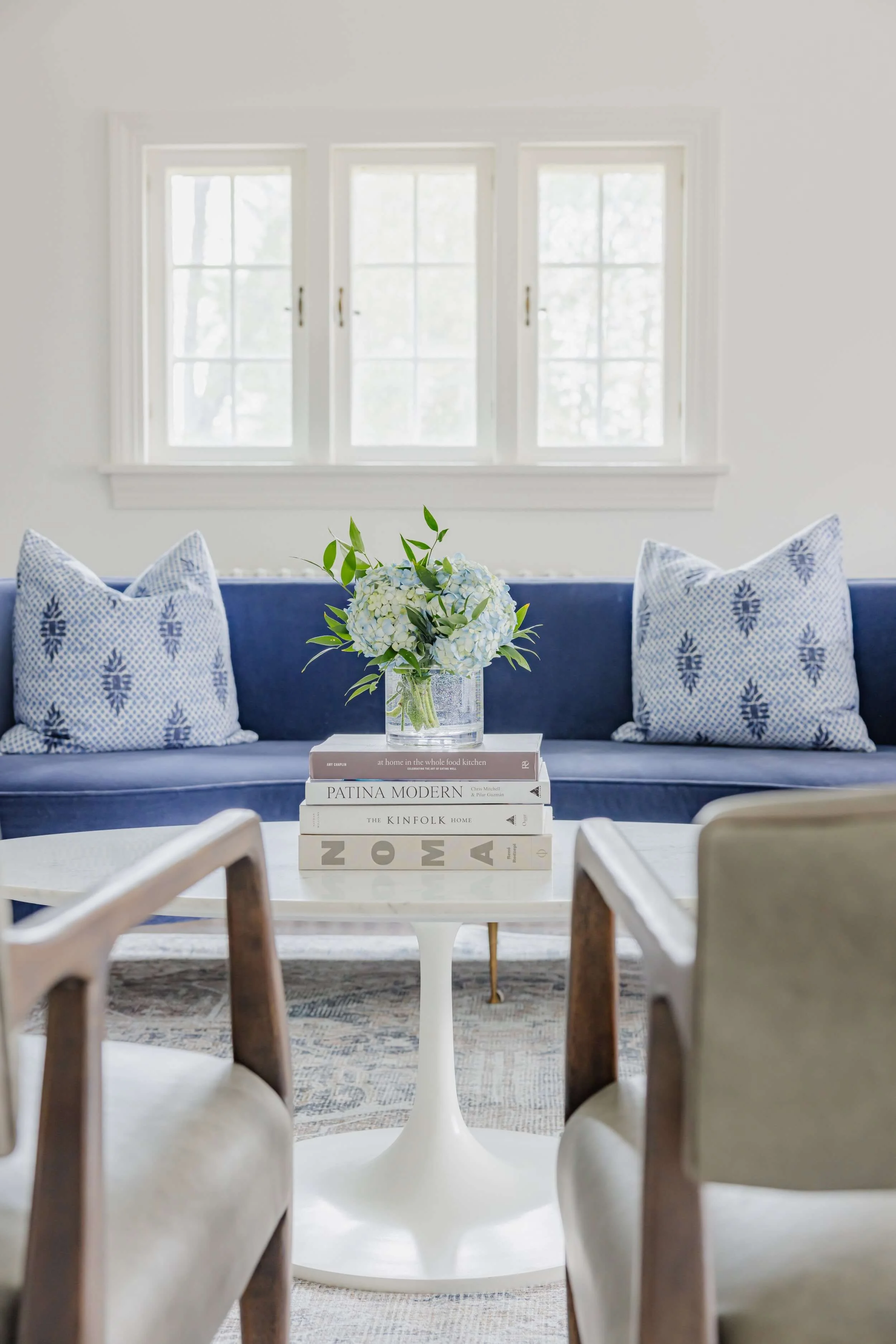 Whit & Well Interior Design Furnishing homes with floral, couches, textiles, rugs, styling, and more.