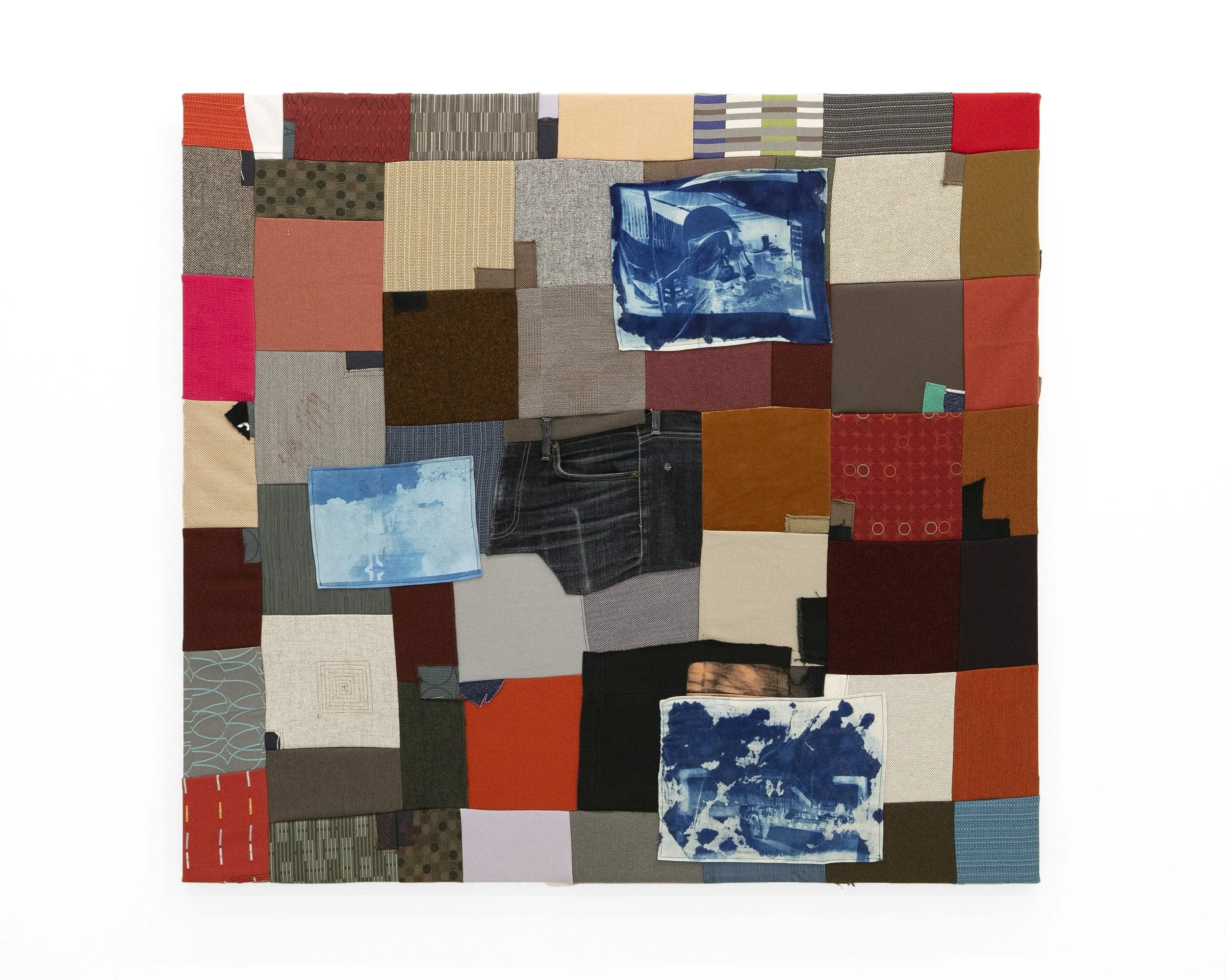 upholstery fabric sewn into a quilt with cyanotype prints on silk and linen