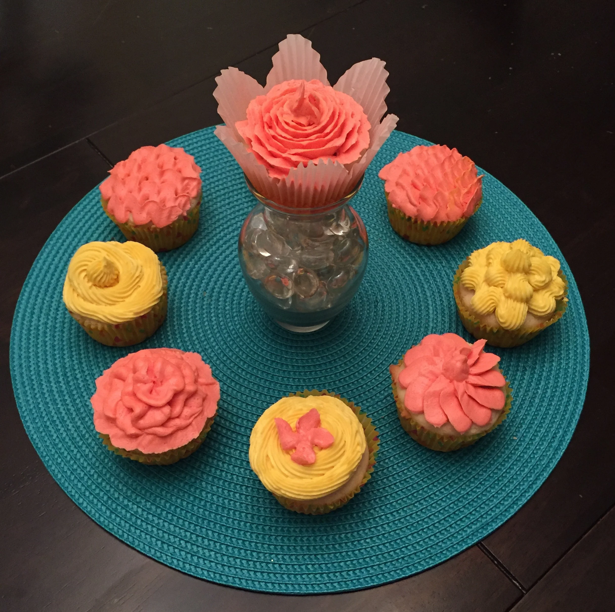   Floral Gluten-free Cupcakes with Vanilla Buttercream :  These beautiful creations show a range of intricacy I can add to any cake, or cupcake.&nbsp; The Rose in the middle is especially beautiful.&nbsp; The gluten-free cupcake is moist and has a bo
